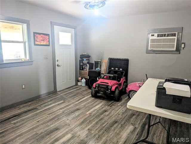 200 N Elm St, Campbell, MO 63933 - entrance foyer with an AC wall unit and wood finished floors