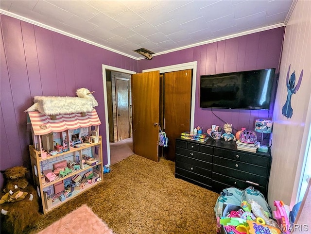 200 N Elm St, Campbell, MO 63933 - bedroom with crown molding, carpet, a closet, and wood walls