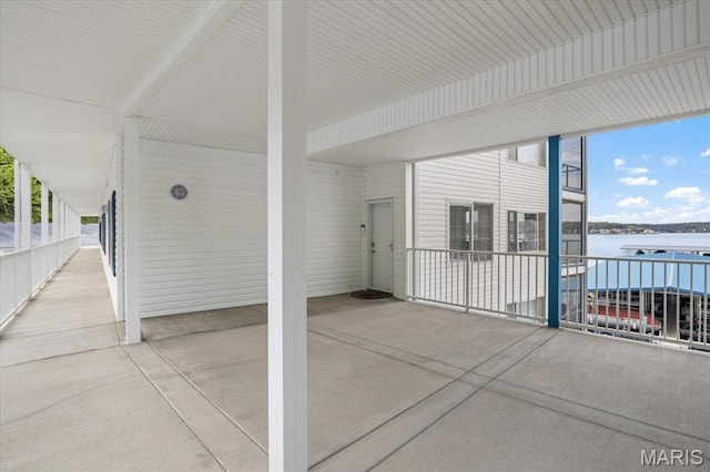 18051 Blue Anchor Dr Unit 533, Gravois Mills, MO 65037 - view of patio / terrace with a water view and a carport
