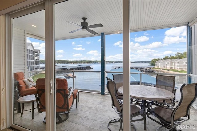 18051 Blue Anchor Dr Unit 533, Gravois Mills, MO 65037 - view of patio / terrace featuring a water view, ceiling fan, and outdoor dining space