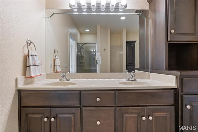 18051 Blue Anchor Dr Unit 533, Gravois Mills, MO 65037 - bathroom with double vanity, a shower with shower door, and a textured wall
