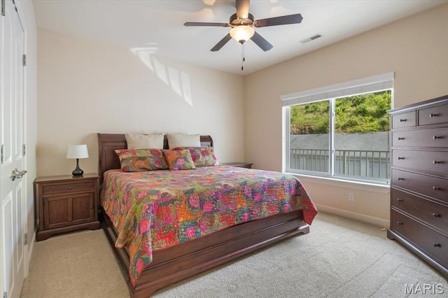 18051 Blue Anchor Dr Unit 533, Gravois Mills, MO 65037 - bedroom with light carpet, baseboards, and a ceiling fan