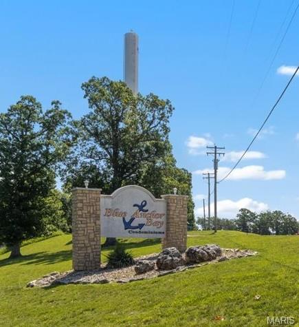 18051 Blue Anchor Dr Unit 533, Gravois Mills, MO 65037 - community sign featuring a lawn