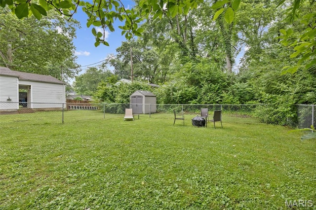 169 W Kirkham Ave, Webster Groves, MO 63119 - fenced backyard with a storage unit and view of wooded area