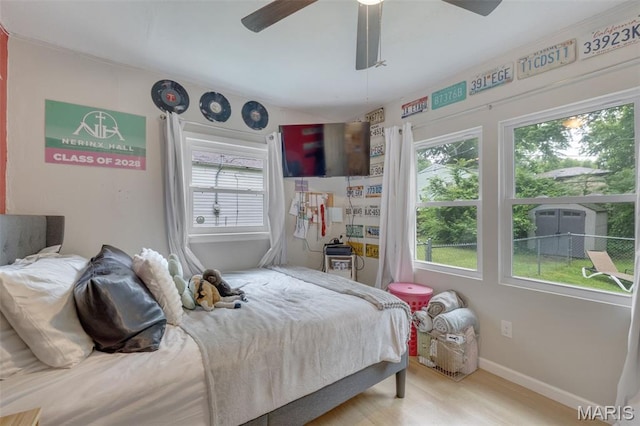 169 W Kirkham Ave, Webster Groves, MO 63119 - bedroom with multiple windows, wood finished floors, and ceiling fan