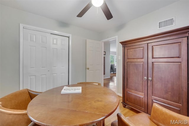 169 W Kirkham Ave, Webster Groves, MO 63119 - dining area featuring a ceiling fan and light wood-style floors