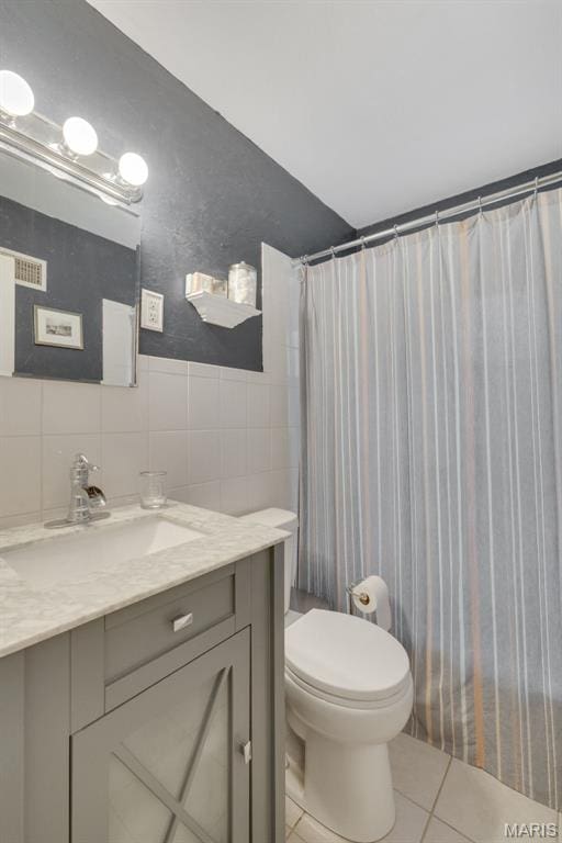 169 W Kirkham Ave, Webster Groves, MO 63119 - bathroom featuring tile walls, vanity, and tile patterned floors