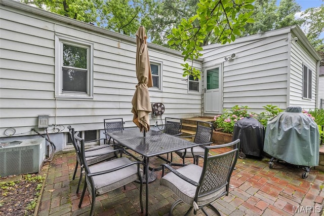 169 W Kirkham Ave, Webster Groves, MO 63119 - view of patio featuring outdoor dining space and area for grilling