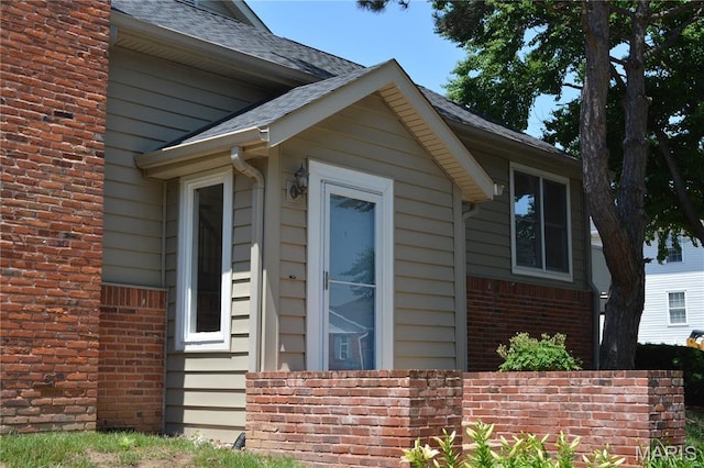 2224 Clayville Ct, Chesterfield, MO 63017 - view of property exterior featuring brick siding and roof with shingles
