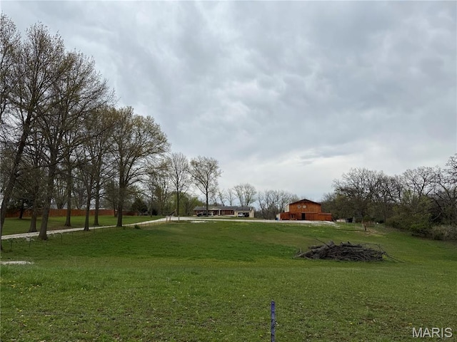 480 N Lindsey Rd, Winfield, MO 63389 - view of community featuring a barn, a lawn, and an outdoor structure
