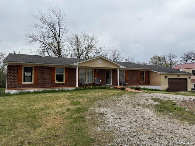 480 N Lindsey Rd, Winfield, MO 63389 - single story home featuring brick siding, driveway, an attached garage, and a front yard