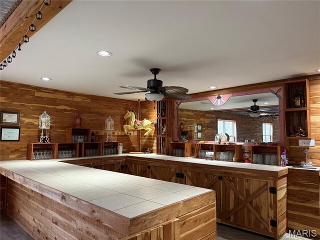 480 N Lindsey Rd, Winfield, MO 63389 - kitchen featuring tile counters, a ceiling fan, wooden walls, and recessed lighting