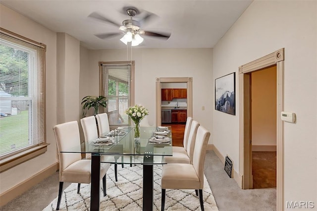 27 N 14th St, Belleville, IL 62220 - dining area with ceiling fan and carpet flooring