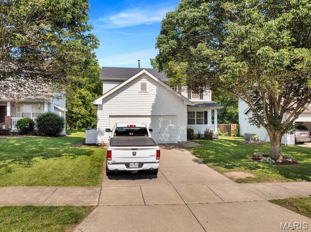 1305 Flintshire Ln, Lake St Louis, MO 63367 - view of front of property featuring concrete driveway and an attached garage