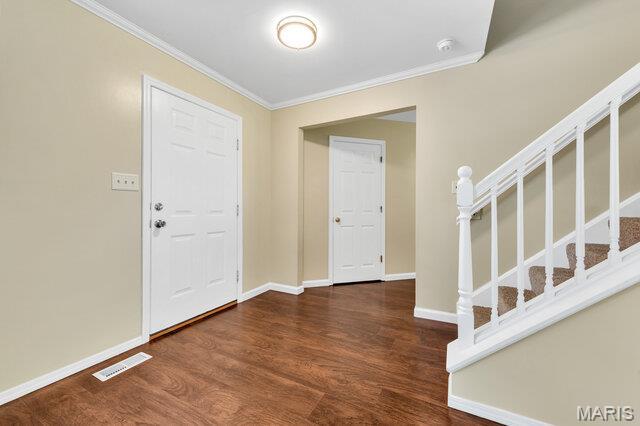1305 Flintshire Ln, Lake St Louis, MO 63367 - foyer entrance with ornamental molding, wood finished floors, and stairway