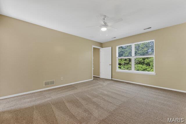 1305 Flintshire Ln, Lake St Louis, MO 63367 - unfurnished room with a ceiling fan and carpet floors