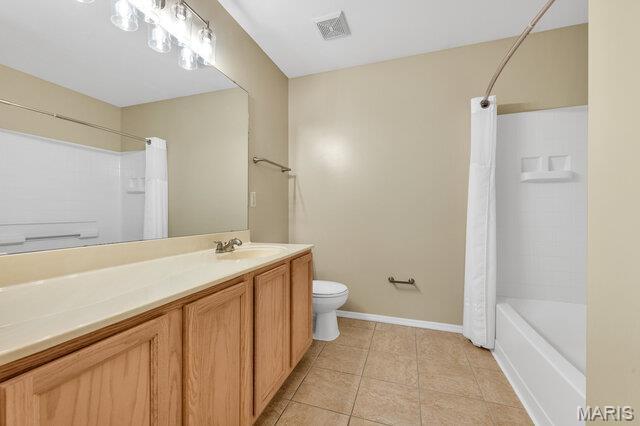 1305 Flintshire Ln, Lake St Louis, MO 63367 - full bathroom with vanity, tile patterned flooring, and shower / tub combo