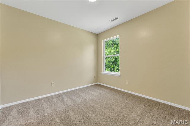 1305 Flintshire Ln, Lake St Louis, MO 63367 - carpeted empty room featuring baseboards
