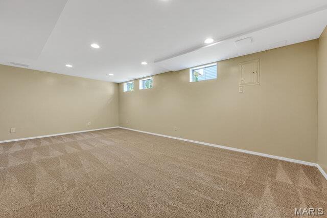 1305 Flintshire Ln, Lake St Louis, MO 63367 - below grade area with light colored carpet, recessed lighting, and electric panel