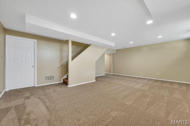 1305 Flintshire Ln, Lake St Louis, MO 63367 - finished basement with carpet flooring, recessed lighting, and stairs