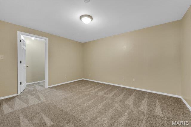 1305 Flintshire Ln, Lake St Louis, MO 63367 - carpeted spare room featuring baseboards
