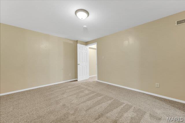 1305 Flintshire Ln, Lake St Louis, MO 63367 - carpeted spare room with baseboards