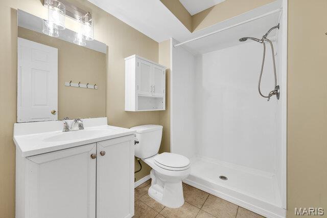 1305 Flintshire Ln, Lake St Louis, MO 63367 - bathroom with a shower, tile patterned flooring, and vanity