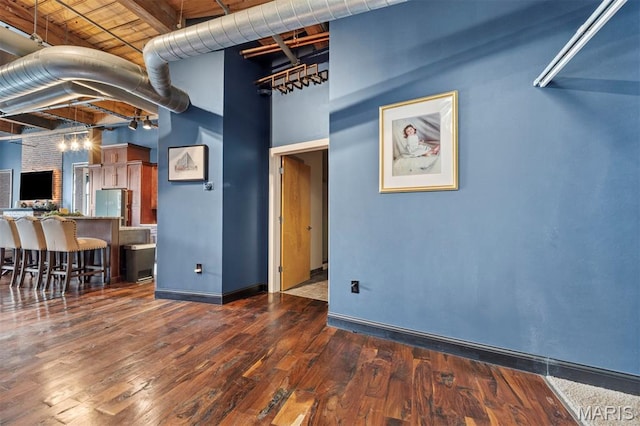 901 Washington Ave Unit 702, Saint Louis, MO 63101 - unfurnished living room with wood finished floors and baseboards