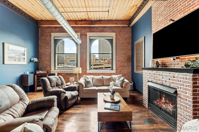 901 Washington Ave Unit 702, Saint Louis, MO 63101 - living room with hardwood / wood-style floors, brick wall, wooden ceiling with exposed beams, and a brick fireplace