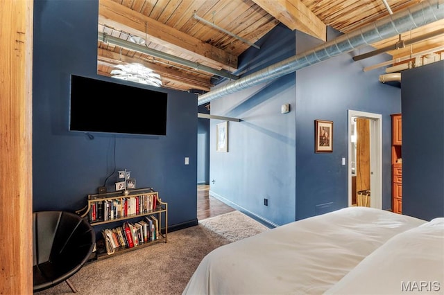 901 Washington Ave Unit 702, Saint Louis, MO 63101 - bedroom featuring wooden ceiling with exposed beams, carpet flooring, and baseboards