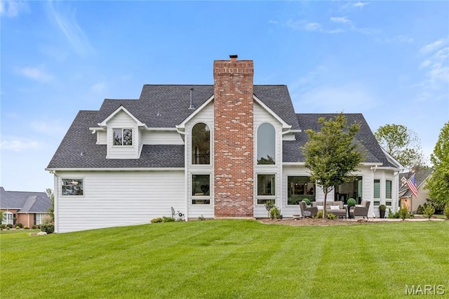 776 Hillenkamp Dr, Weldon Spring, MO 63304 - back of house featuring a lawn, an outdoor living space, a chimney, and roof with shingles