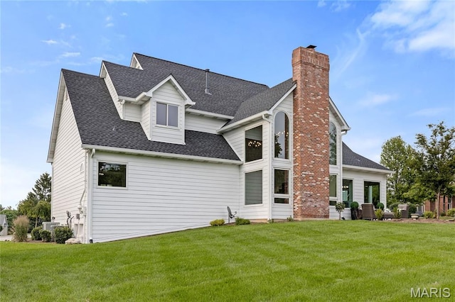 776 Hillenkamp Dr, Weldon Spring, MO 63304 - rear view of house featuring a chimney, a yard, and roof with shingles