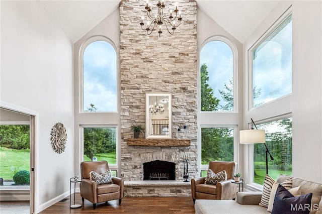 776 Hillenkamp Dr, Weldon Spring, MO 63304 - living area with high vaulted ceiling, a chandelier, wood finished floors, and a fireplace