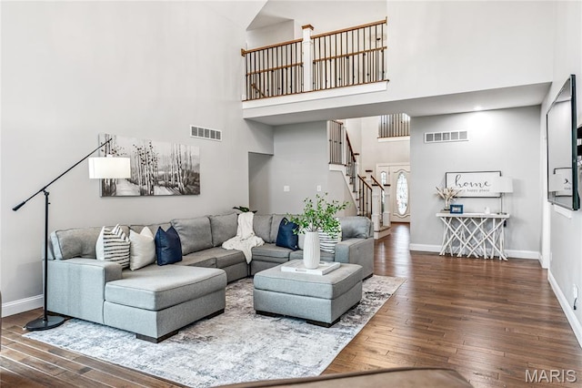776 Hillenkamp Dr, Weldon Spring, MO 63304 - living area featuring a towering ceiling, wood-type flooring, and stairs