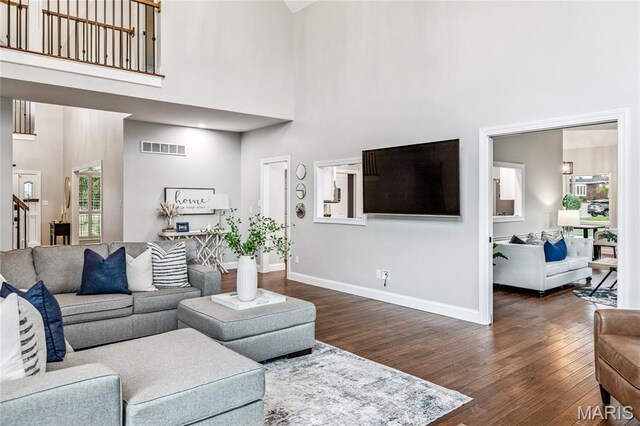 776 Hillenkamp Dr, Weldon Spring, MO 63304 - living room with a towering ceiling and dark wood-style flooring