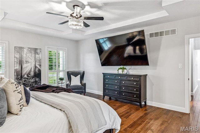 776 Hillenkamp Dr, Weldon Spring, MO 63304 - bedroom featuring a tray ceiling, wood finished floors, and a ceiling fan