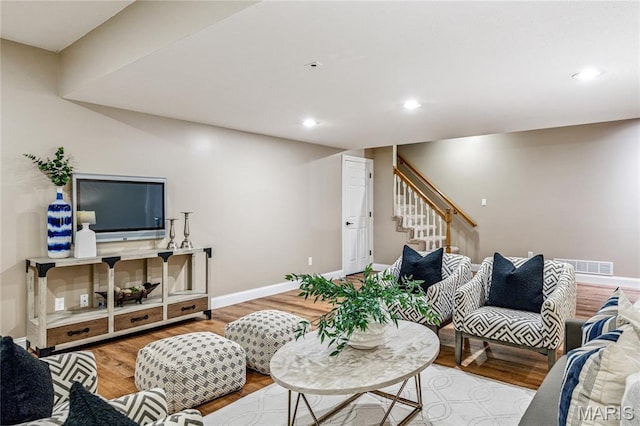776 Hillenkamp Dr, Weldon Spring, MO 63304 - living room with wood finished floors, stairs, and recessed lighting