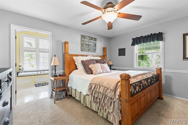 2004 Possum Hollow Rd, Farmington, MO 63640 - bedroom featuring multiple windows, light colored carpet, a textured ceiling, and ceiling fan