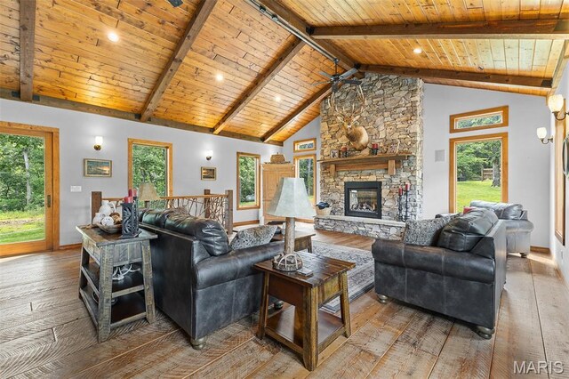 2004 Possum Hollow Rd, Farmington, MO 63640 - living area with light wood finished floors, wooden ceiling with exposed beams, a fireplace, plenty of natural light, and baseboards