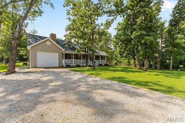 2004 Possum Hollow Rd, Farmington, MO 63640 - view of front of property featuring covered porch, a chimney, an attached garage, and a front yard