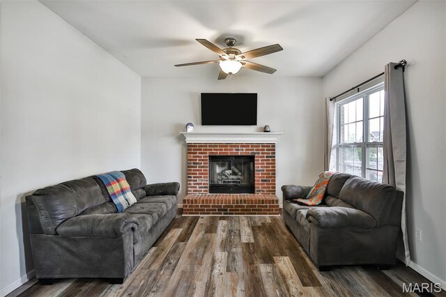 505 Lias Way, Wentzville, MO 63385 - living area featuring wood finished floors, ceiling fan, and a brick fireplace