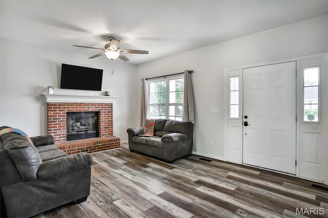 505 Lias Way, Wentzville, MO 63385 - living room featuring a ceiling fan, wood finished floors, and a fireplace