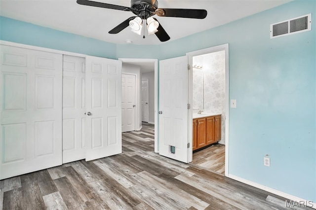 505 Lias Way, Wentzville, MO 63385 - unfurnished bedroom featuring a closet, light wood finished floors, a ceiling fan, and ensuite bath