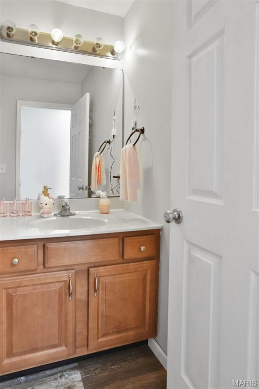 505 Lias Way, Wentzville, MO 63385 - bathroom featuring vanity and wood finished floors