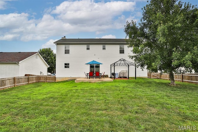 505 Lias Way, Wentzville, MO 63385 - back of house featuring a gazebo, a patio, and a fenced backyard