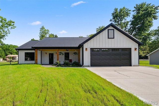 63 Plackemeier Dr, Ofallon, MO 63366 - modern inspired farmhouse featuring a garage, driveway, a front lawn, and metal roof
