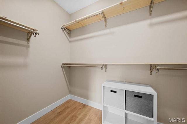 63 Plackemeier Dr, Ofallon, MO 63366 - walk in closet featuring light wood finished floors