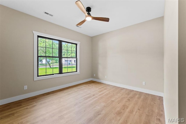 63 Plackemeier Dr, Ofallon, MO 63366 - empty room with light wood-style flooring, a ceiling fan, and baseboards