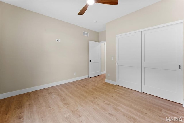 63 Plackemeier Dr, Ofallon, MO 63366 - unfurnished bedroom with light wood-style flooring, baseboards, a closet, and a ceiling fan
