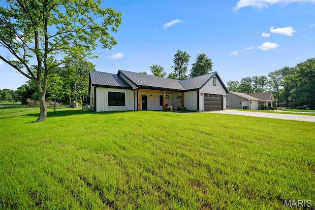 63 Plackemeier Dr, Ofallon, MO 63366 - modern farmhouse style home featuring board and batten siding, a garage, driveway, a front lawn, and metal roof